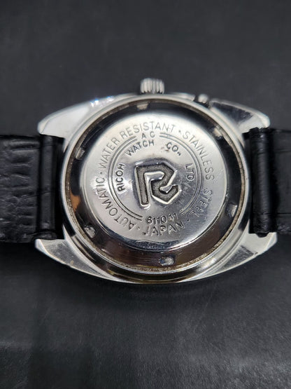 Vintage Ricoh R31 Automatic Black Face New Strap 21 Jewels Day-Date Men's Wrist Watch AS38