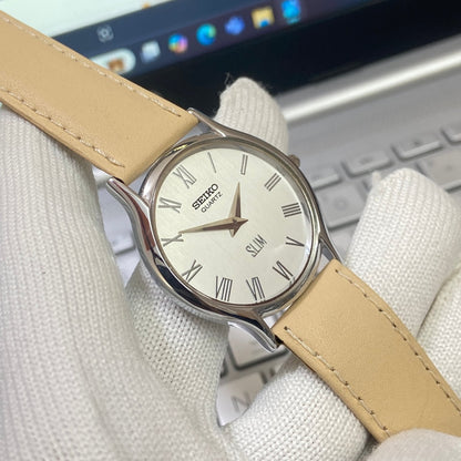 Vintage Seiko Slim Quartz White Face Cream Band Men's Wrist Watch C09