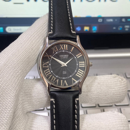 Vintage Seiko Slim Quartz Black Face Black Band Men's Wrist Watch C12