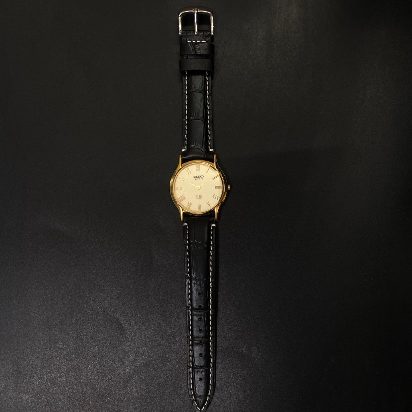 Vintage Seiko Slim Quartz Golden Face Black Band Men's Wrist Watch C14