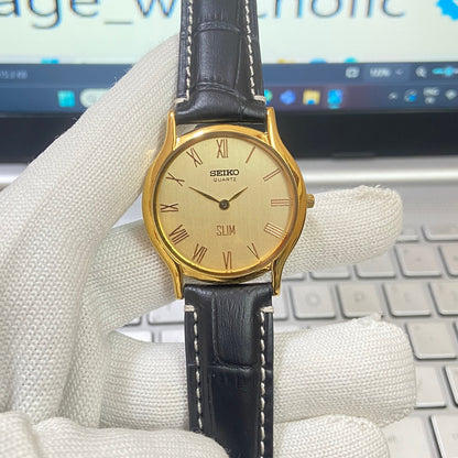 Vintage Seiko Slim Quartz Golden Face Black Band Men's Wrist Watch C14