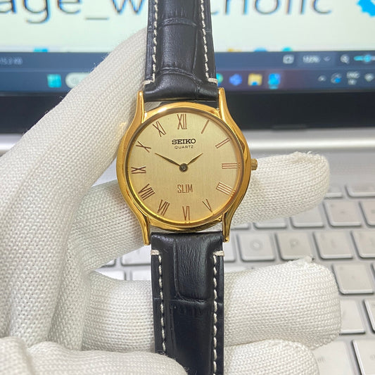 Vintage Seiko Slim Quartz Golden Face Black Band Men's Wrist Watch C14