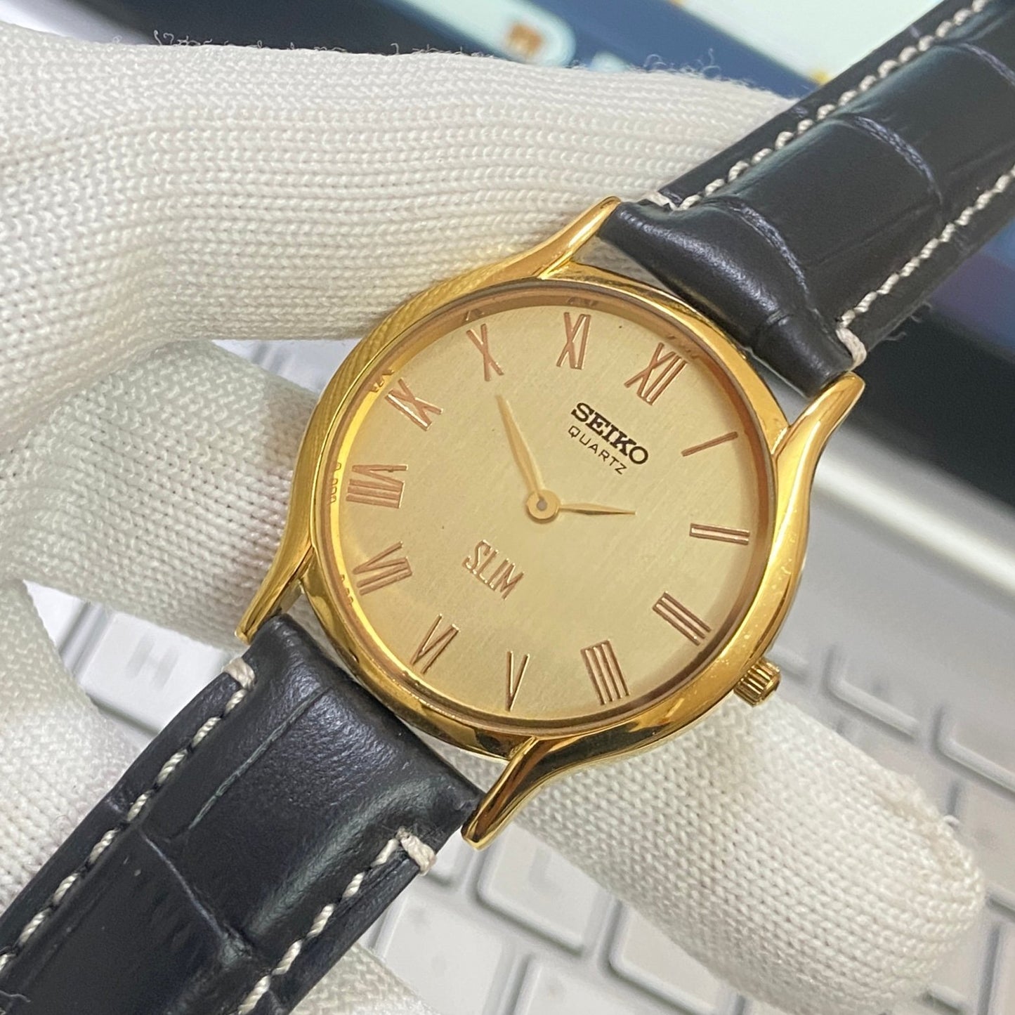Vintage Seiko Slim Quartz Golden Face Black Band Men's Wrist Watch C14