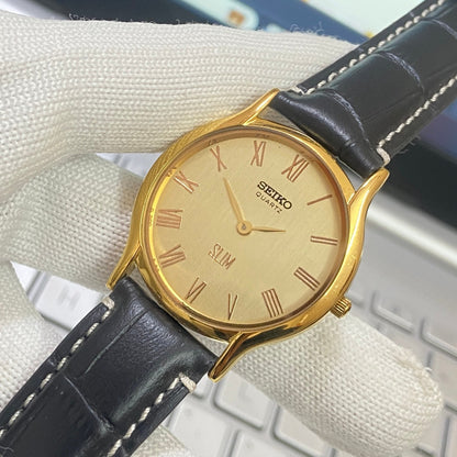 Vintage Seiko Slim Quartz Golden Face Black Band Men's Wrist Watch C14