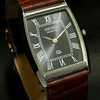 Seiko Slim Barrel Quartz Black Face Brown Band Men's Wrist Watch C83