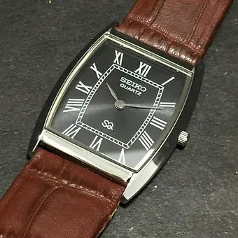 Seiko Slim Barrel Quartz Black Face Brown Band Men's Wrist Watch C83