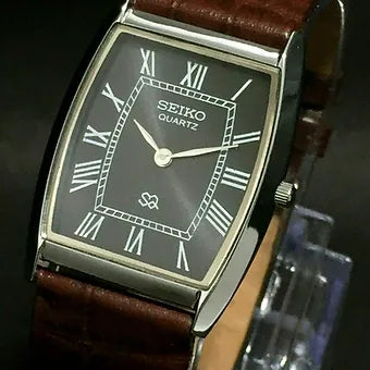 Seiko Slim Barrel Quartz Black Face Brown Band Men's Wrist Watch C83