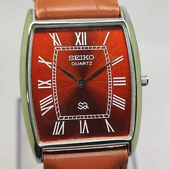 Seiko Slim Barrel Quartz Red Face Brown Band Men's Wrist Watch C84