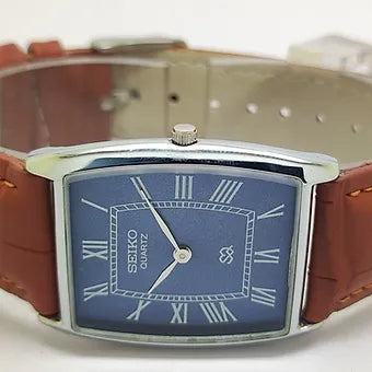 Seiko Slim Barrel Quartz Blue Face Brown Band Men's Wrist Watch C87