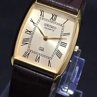 Seiko Slim Barrel Quartz Golden Face Brown Band Men's Wrist Watch C95